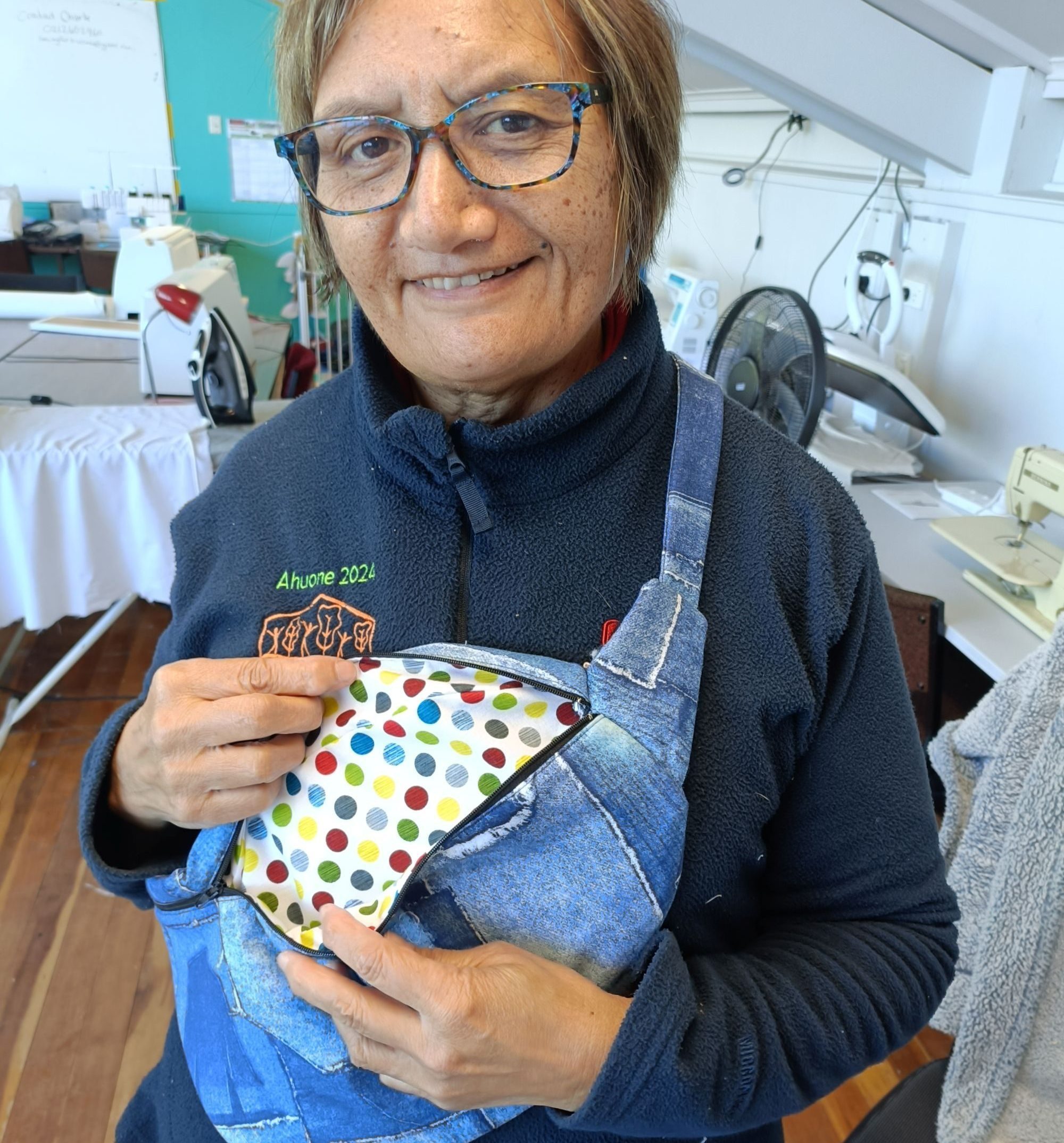 Our tutor Di holding a bag
